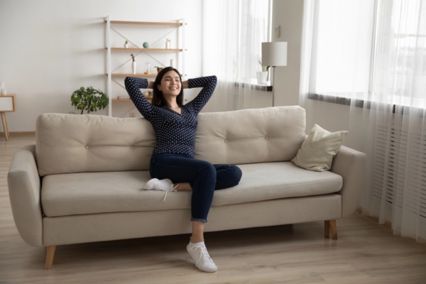 lady lounging on the couch depicting peace of mind