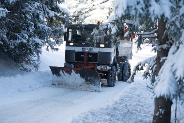 snow truck clearing snow on roads