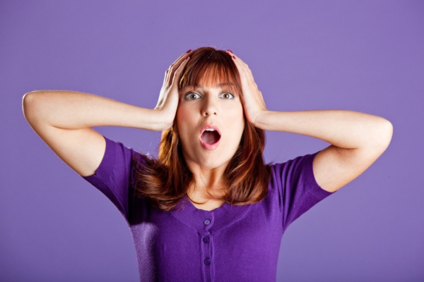 woman with a worried face depicting Understanding the True Financial Impact of Power Outages