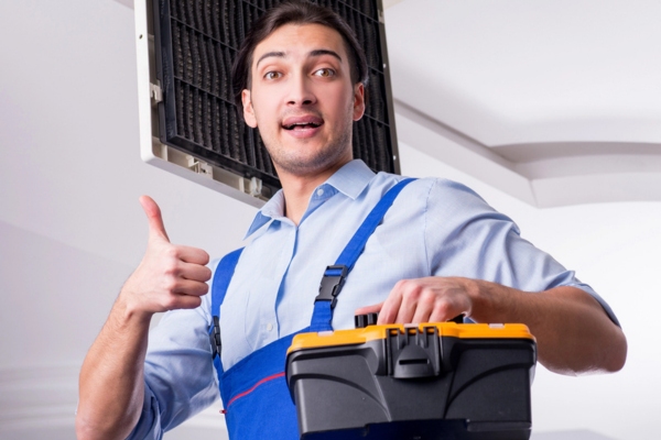 HVAC contractor with his toolbox doing a thumbs up