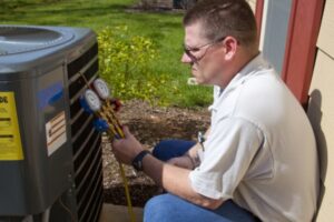 HVAC professional examining HVAC system