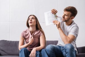 couple feeling extreme heat due to power outage in summer