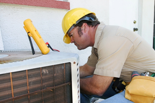 Air conditioner maintenance by a professional HVAC technician