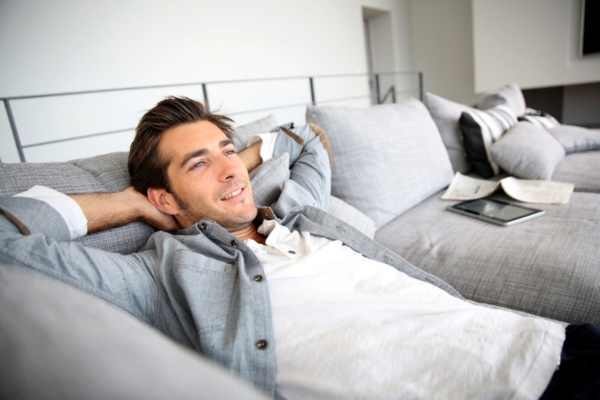 man relaxing on a couch depicting good indoor air quality