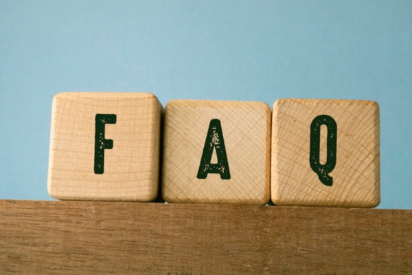 FAQ spelled using wooden letter cubes depicting Air Conditioning Safety questions
