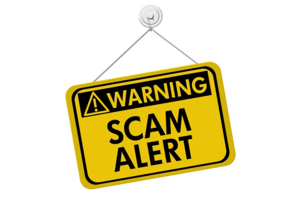 Warning scam alert door sign depicting air conditioner repair