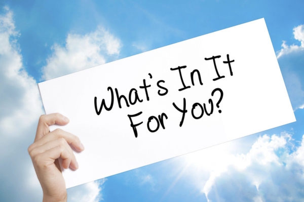 What's In It For You sign on white paper depicting landscaping around heating oil tank