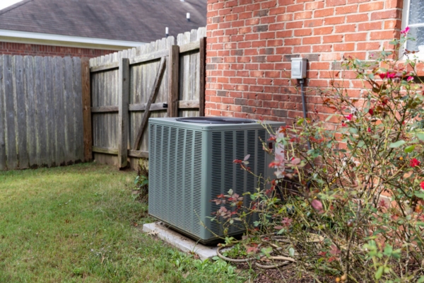 air conditioner next to a home