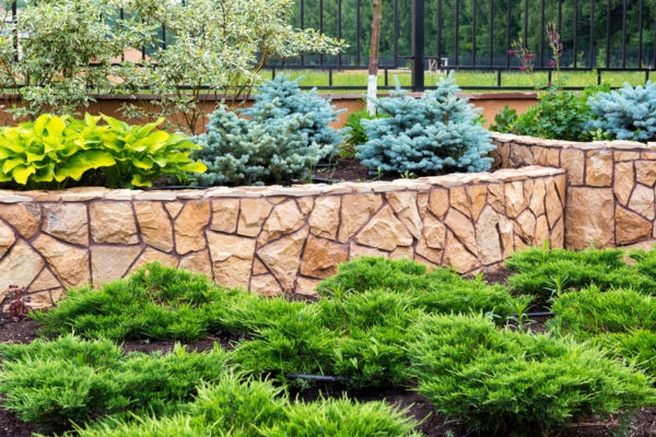 natural landscaping in a home garden for heating oil tank