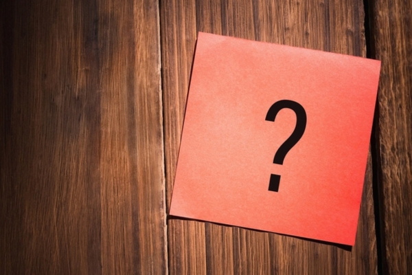 question mark on a sticky note on top of a wood surface depicting Local Heating Oil Supplier FAQs