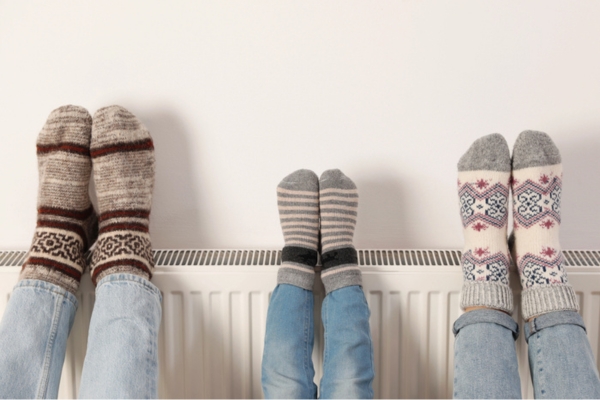 family warming legs on an heating oil radiator