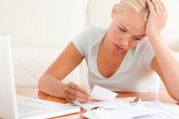 woman comparing oil and electric heating expenses